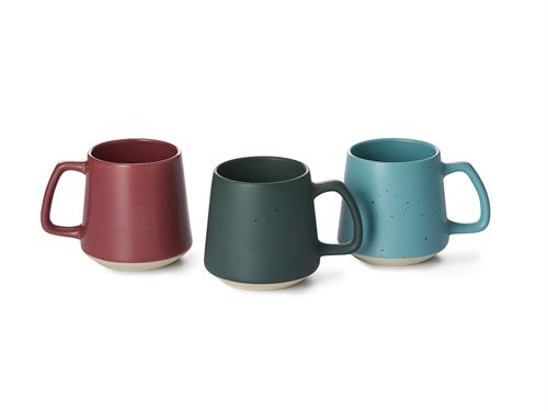 Three ceramic mugs in red, green, and blue on a white background