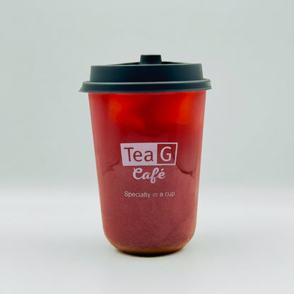A translucent red reusable coffee cup with a black lid and a printed white logo reading 'Tea G Café' on the front, photographed against a light gray studio background.
