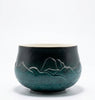 Ceramic bowl with mountain design on a white background